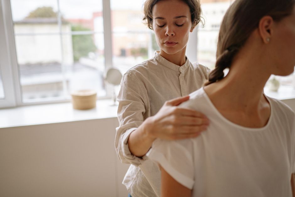 A physical therapist working with a patient